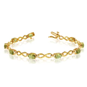 10K Yellow Gold Oval Peridot Stones And Diamonds Infinity Tennis Bracelet, 7"